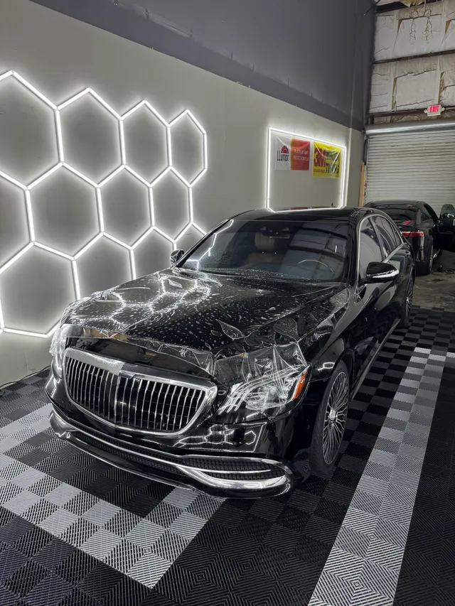 Black Mercedes-Maybach sedan having paint protection film fitted to the hood and front end in Alpharetta, GA